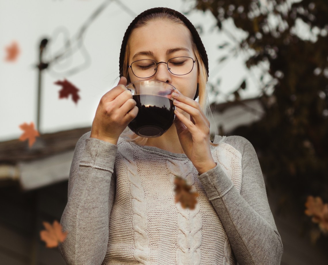 girl sipping coffee with leaves, fall girl, content