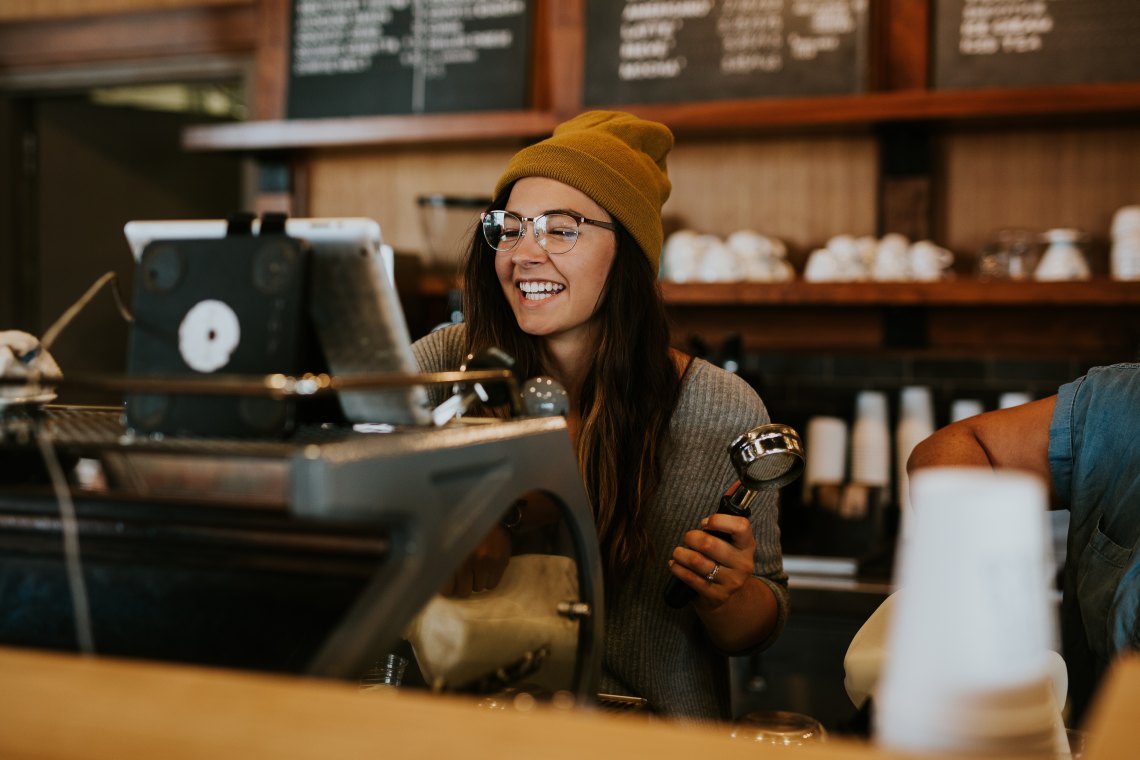 girl laughing coffee shop hat