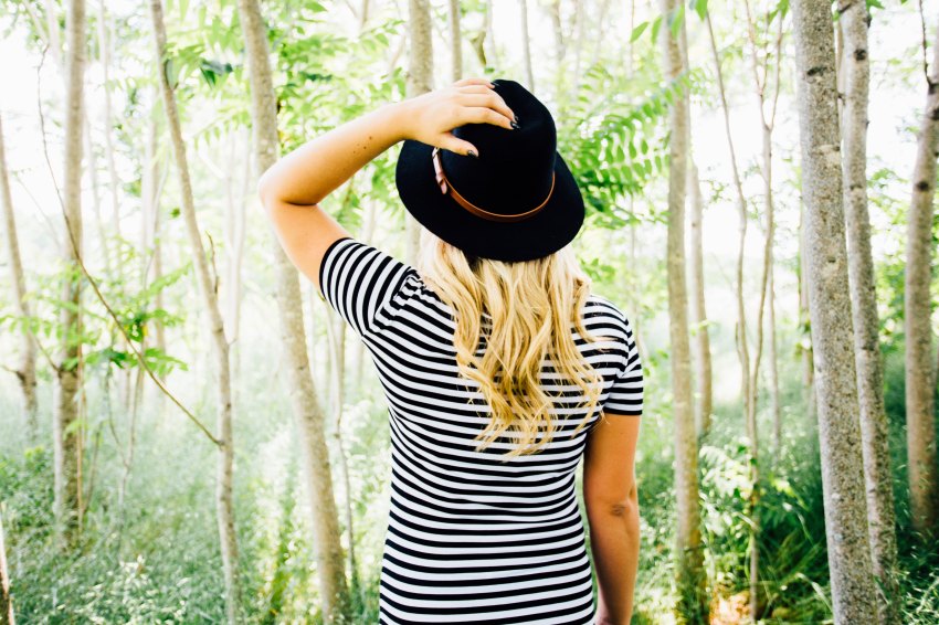 Woman standing in trees