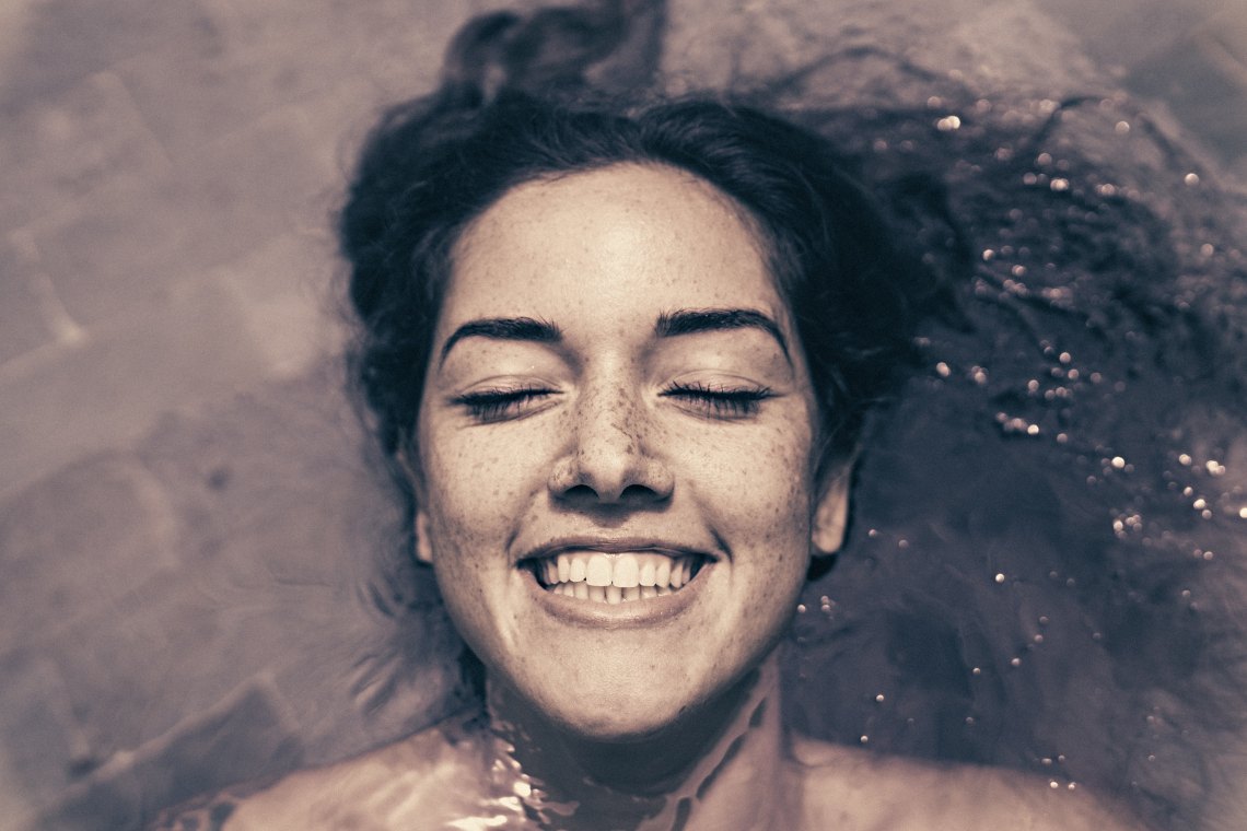 girl underwater smiling, happy girl, you are evolving, loving yourself, you are whole