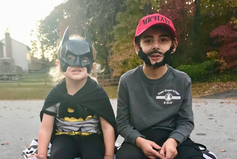 Little boy dressed as his dad for Halloween and his little sister dressed up as batman