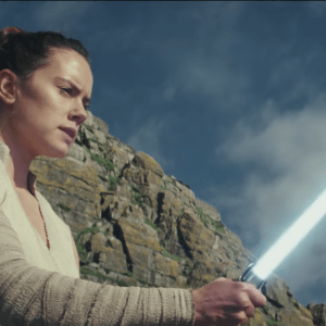 Rei from Star Wars holding a light sabor in 'The Last Jedi" trailer