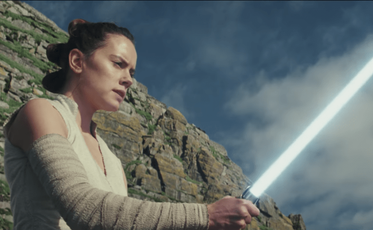 Rei from Star Wars holding a light sabor in 'The Last Jedi" trailer