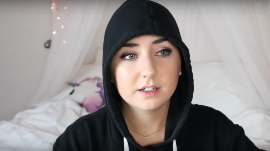 Hannah Forcier in her video about losing her hair from hair relaxer