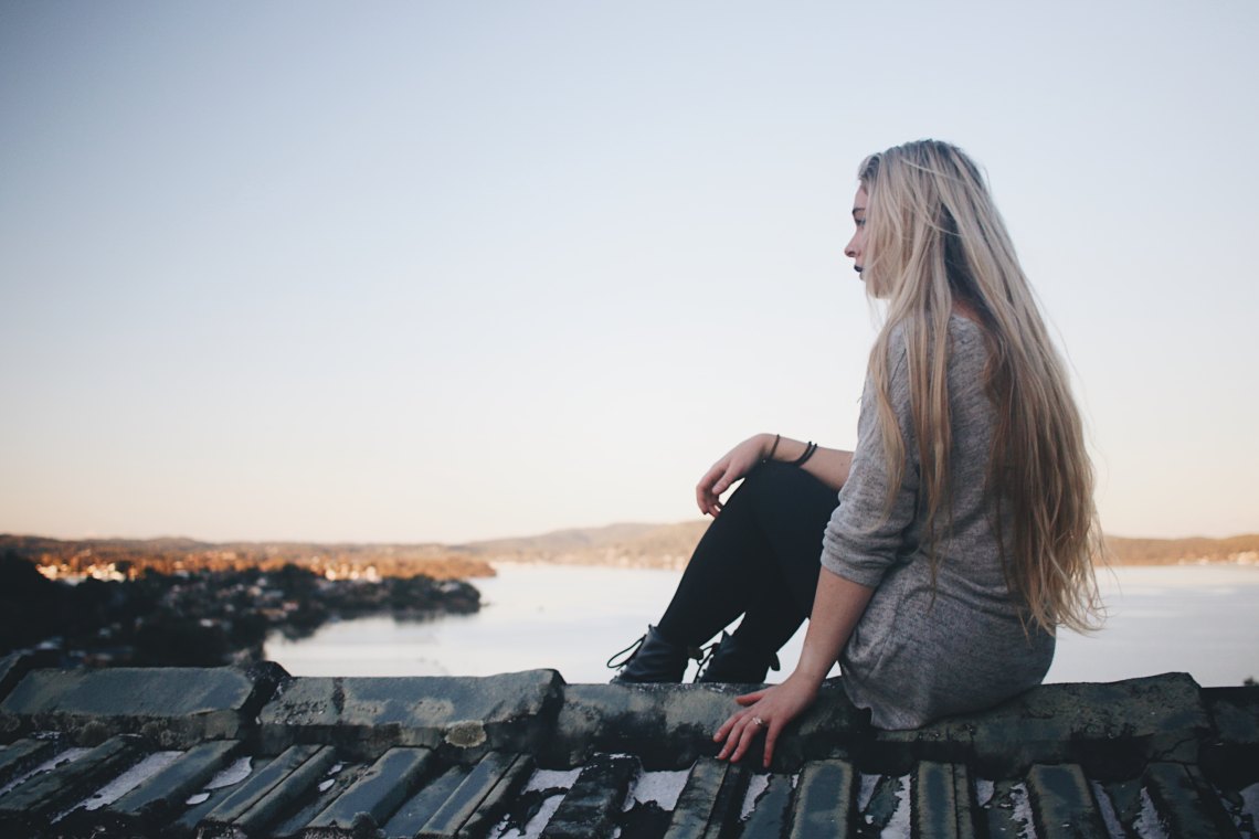 girl with long blonde hair looking