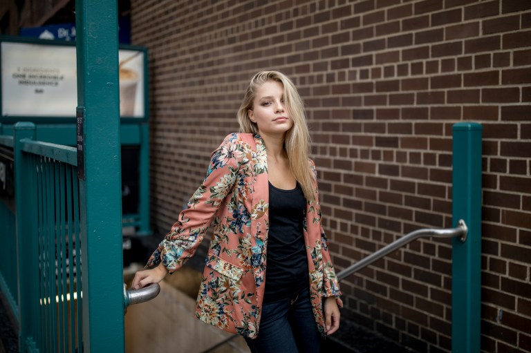 young blond woman confident near subway