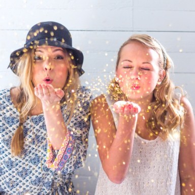 girls blowing glitter