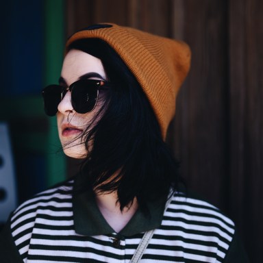 fashionable girl with sunglasses and beanie on
