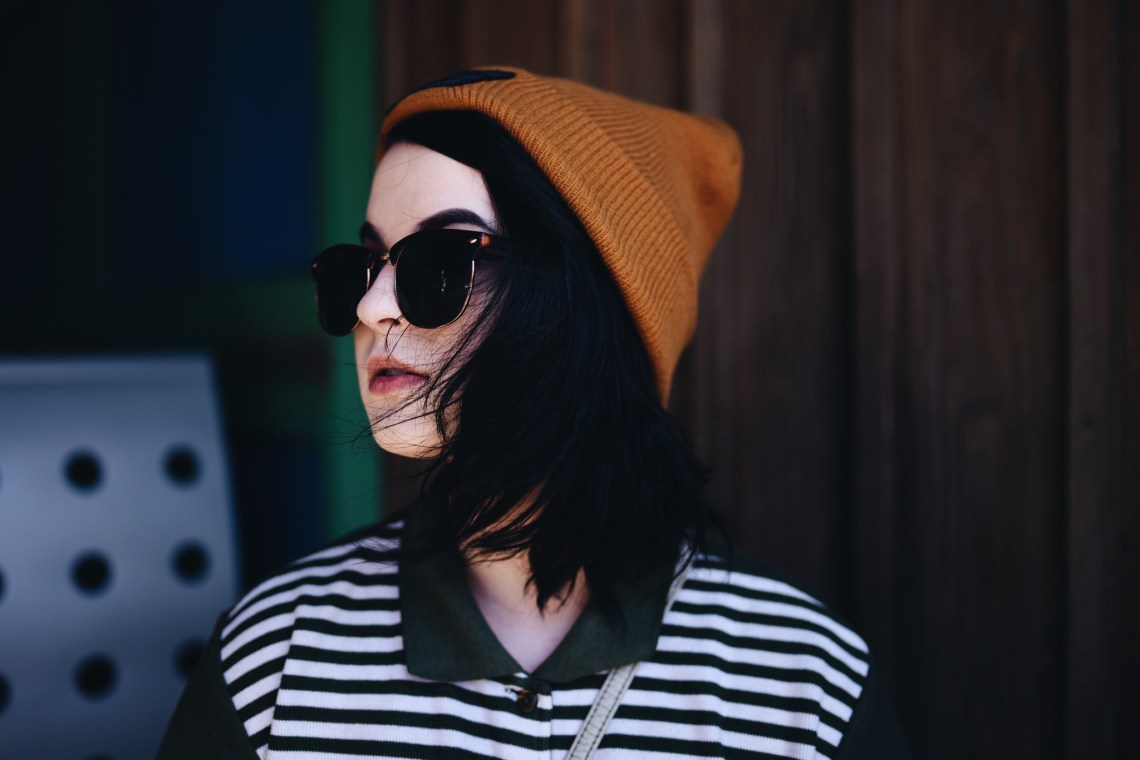 fashionable girl with sunglasses and beanie on