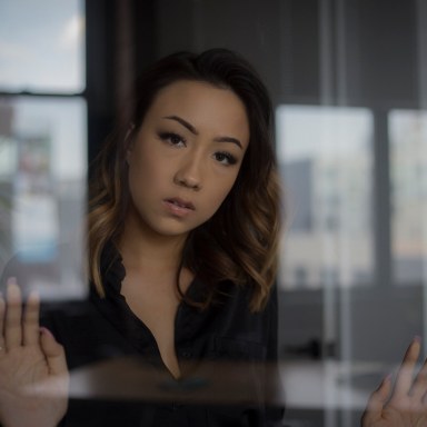 unamused woman seen through the window