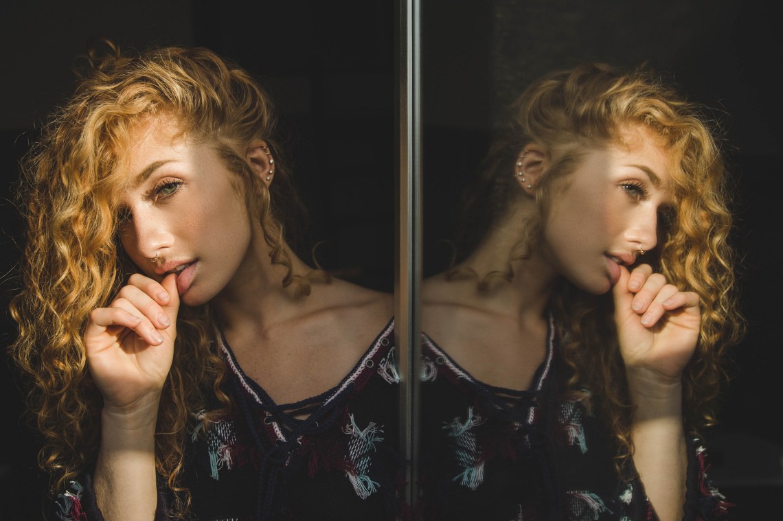 seductive girl admiring reflection