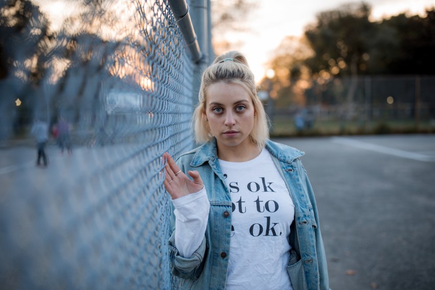 Serious blonde woman staring at camera