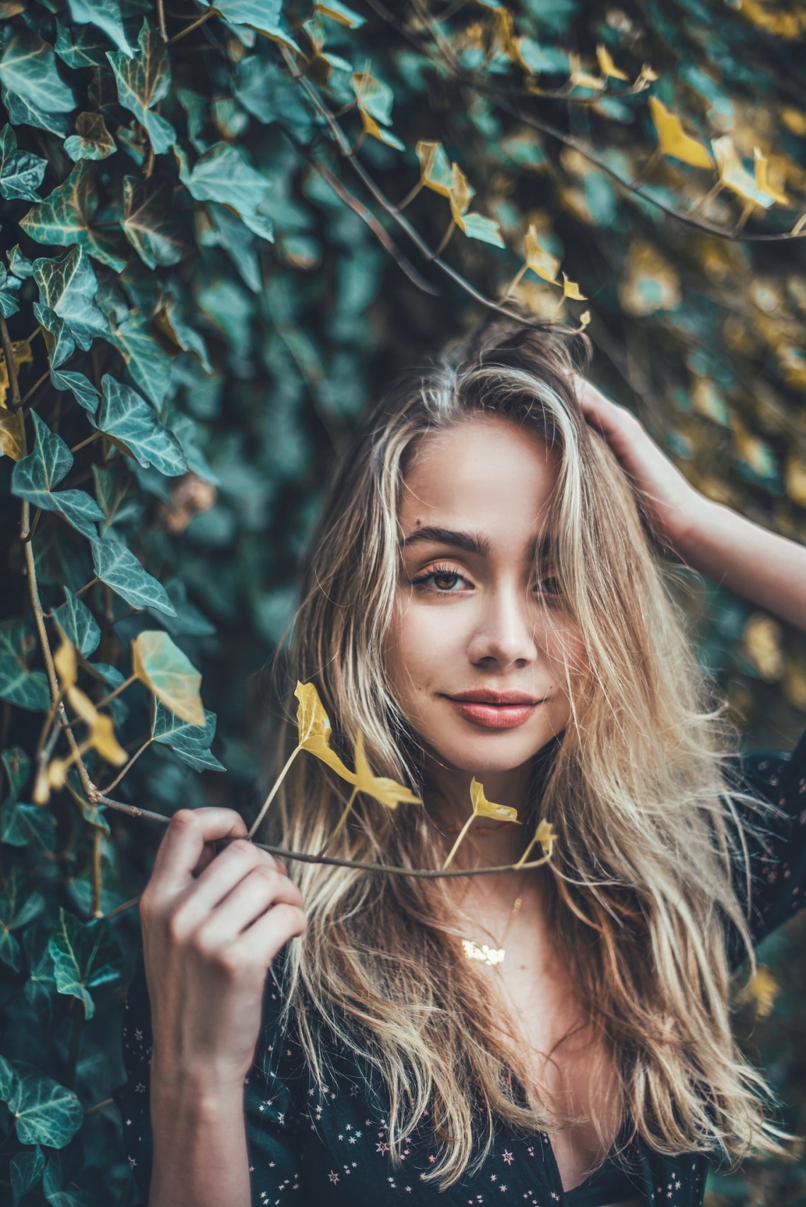 An Enchanting Day as an Enchanting Woman Emerges Through the Leaves