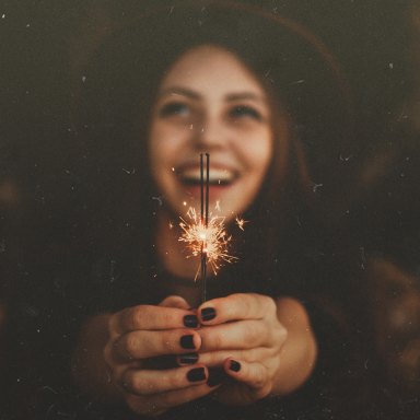 Woman holding up sparkler