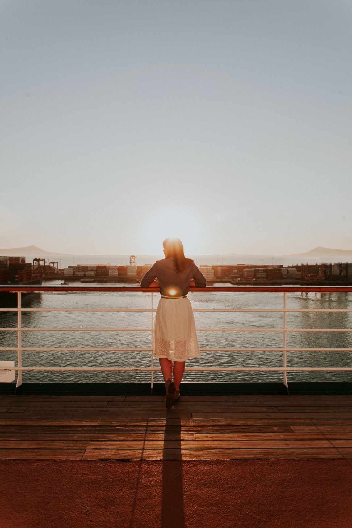 woman standing in front of lake
