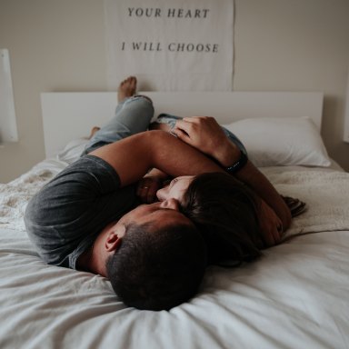 Couple hugging on bed