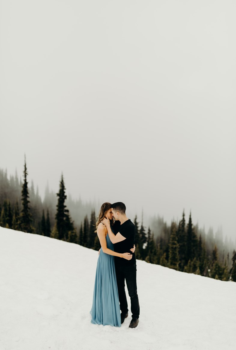 couple on a snowy hill
