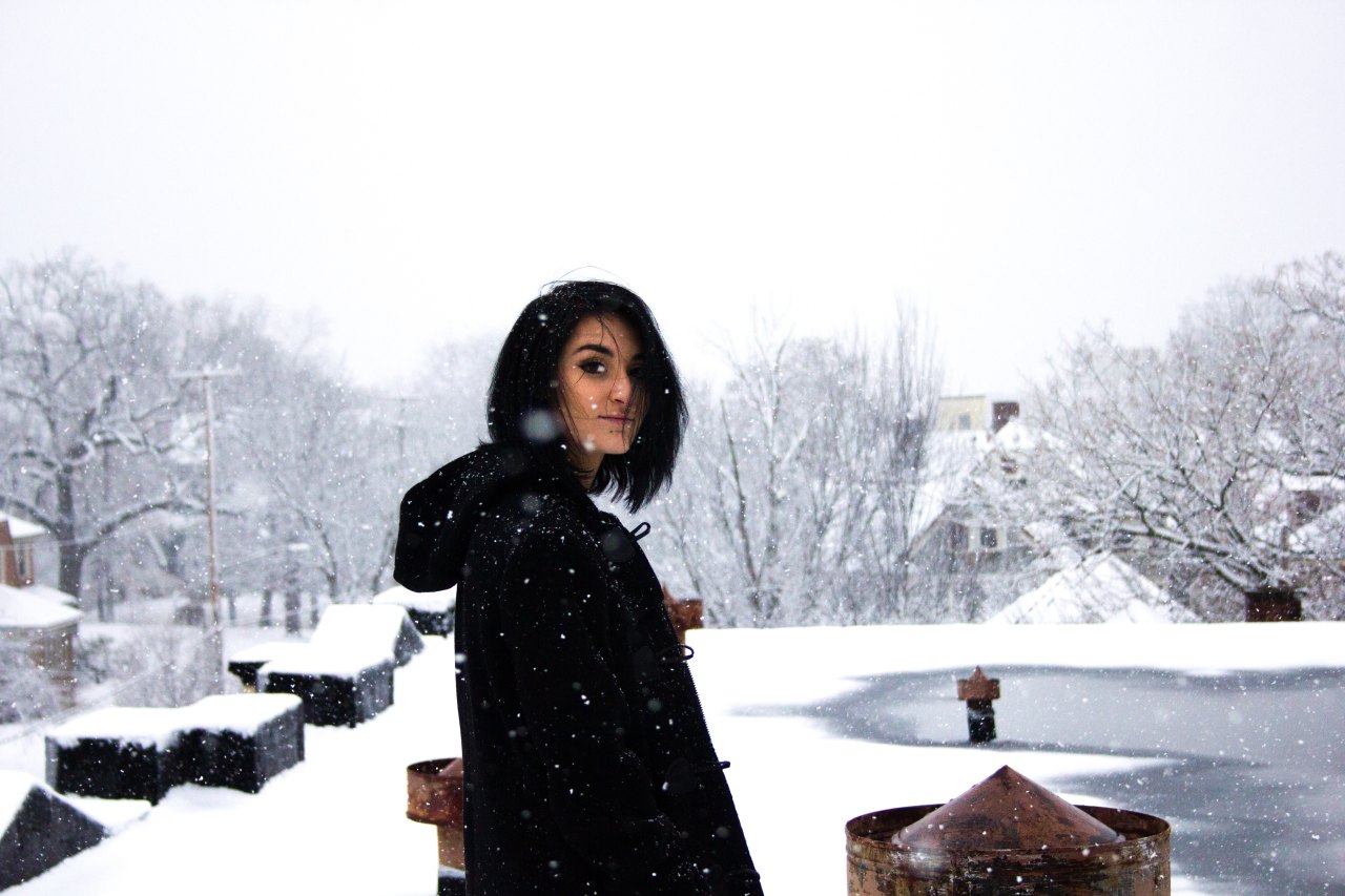 girl standing in the snow