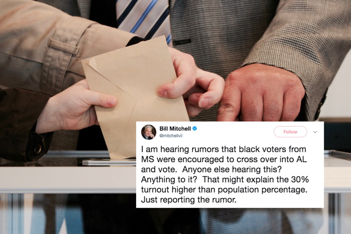 People in a voting booth casting their ballots