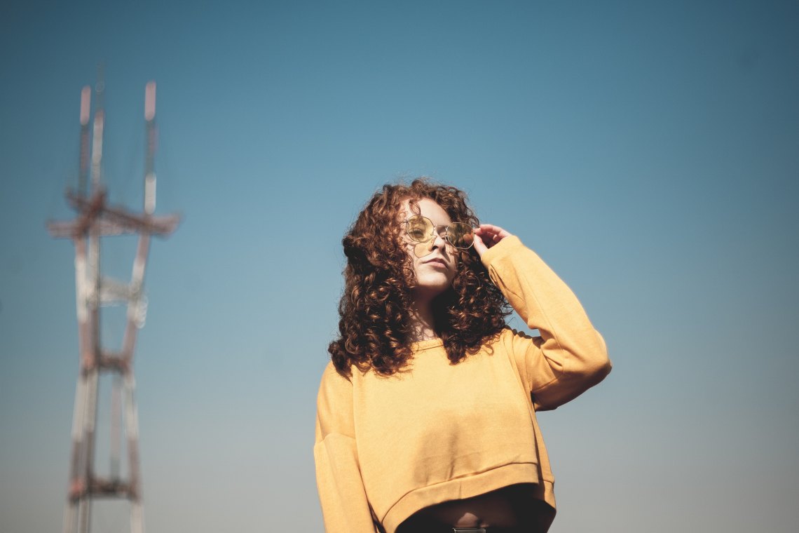 woman in a yellow sweater