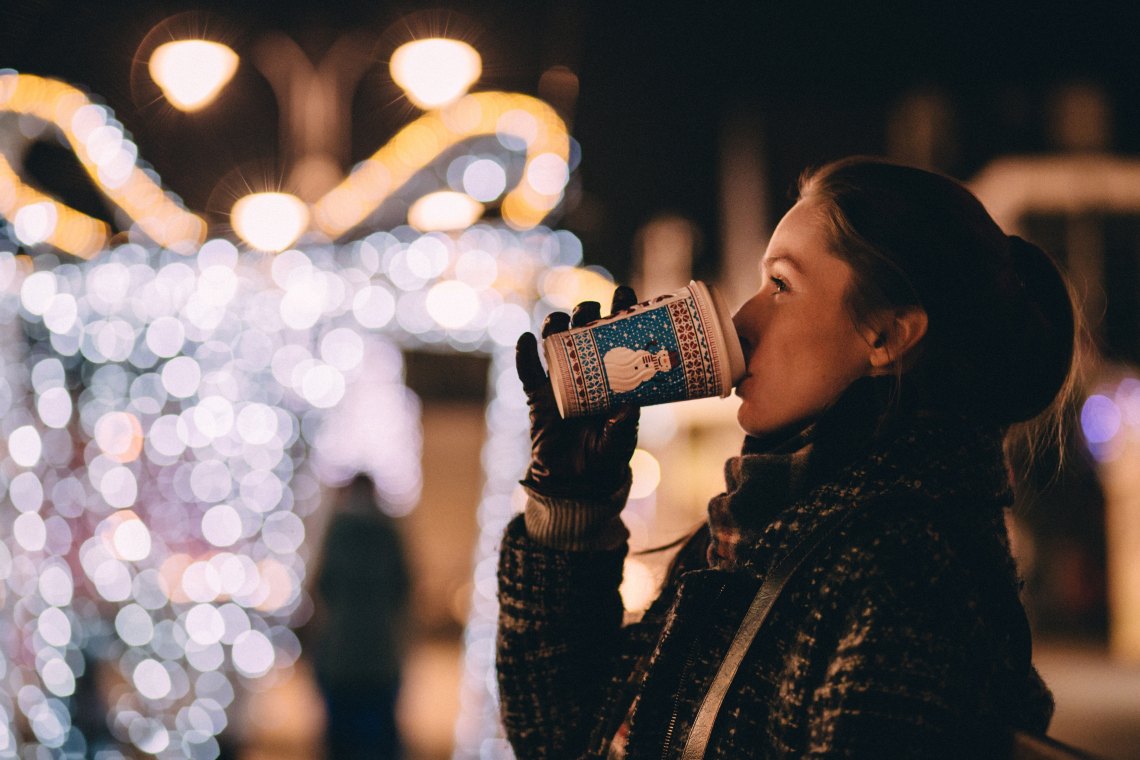 girl drinking coffee at christmas time