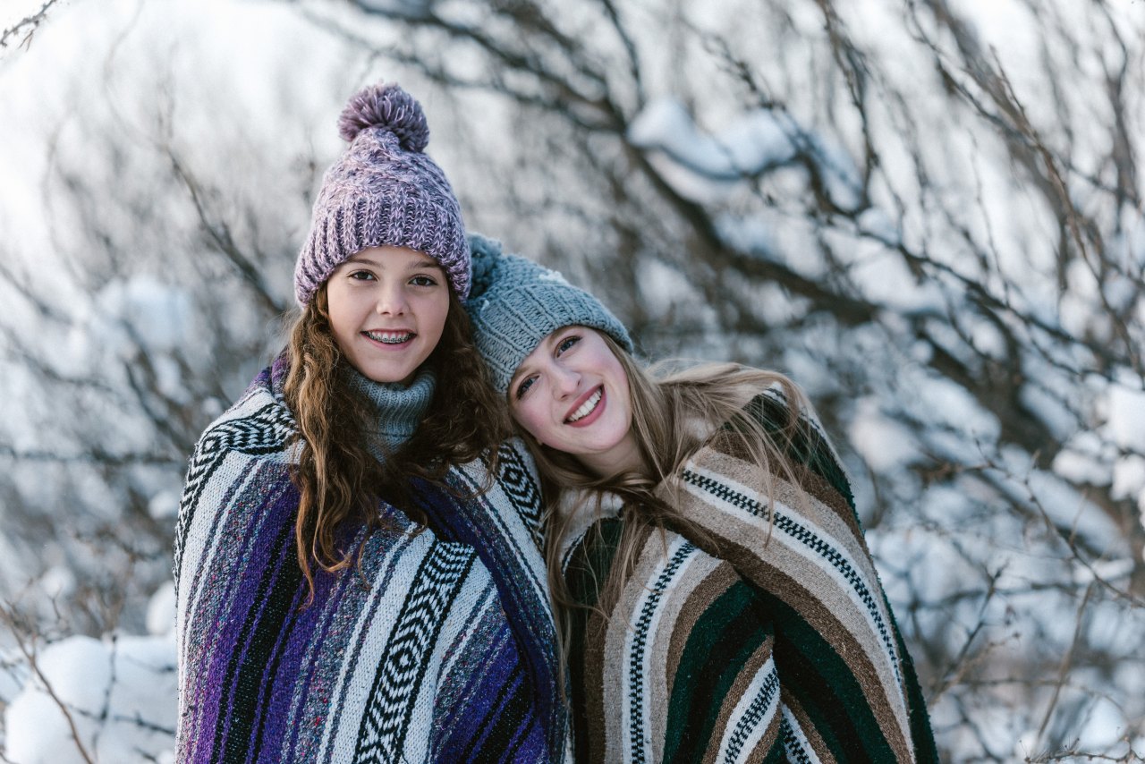 sisters wrapped in blankets