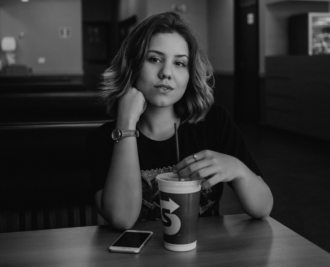 black and white, girl sitting in cafe, smug girl, distance from toxic people, toxic people, new year, people to distance from, based on your zodiac sign, zodiac sign, zodiac