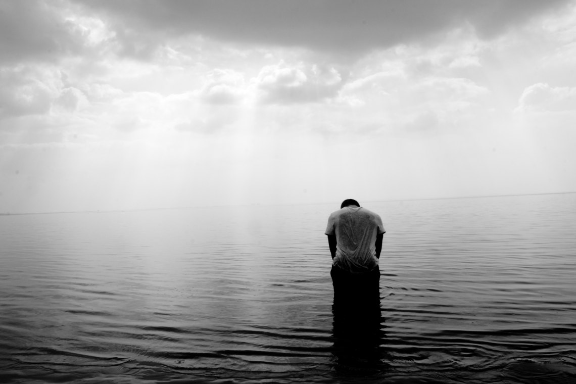 black and white standin gin the water
