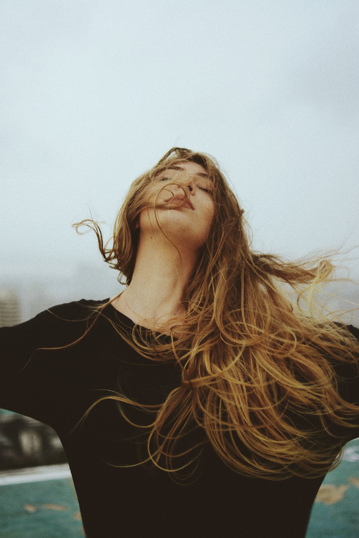 woman head back arms outstretched