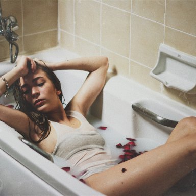 woman sitting in bathtub