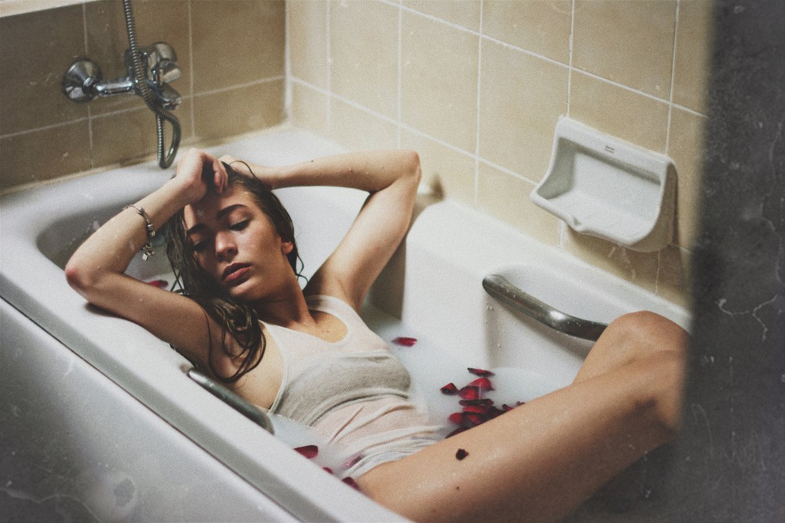 woman sitting in bathtub