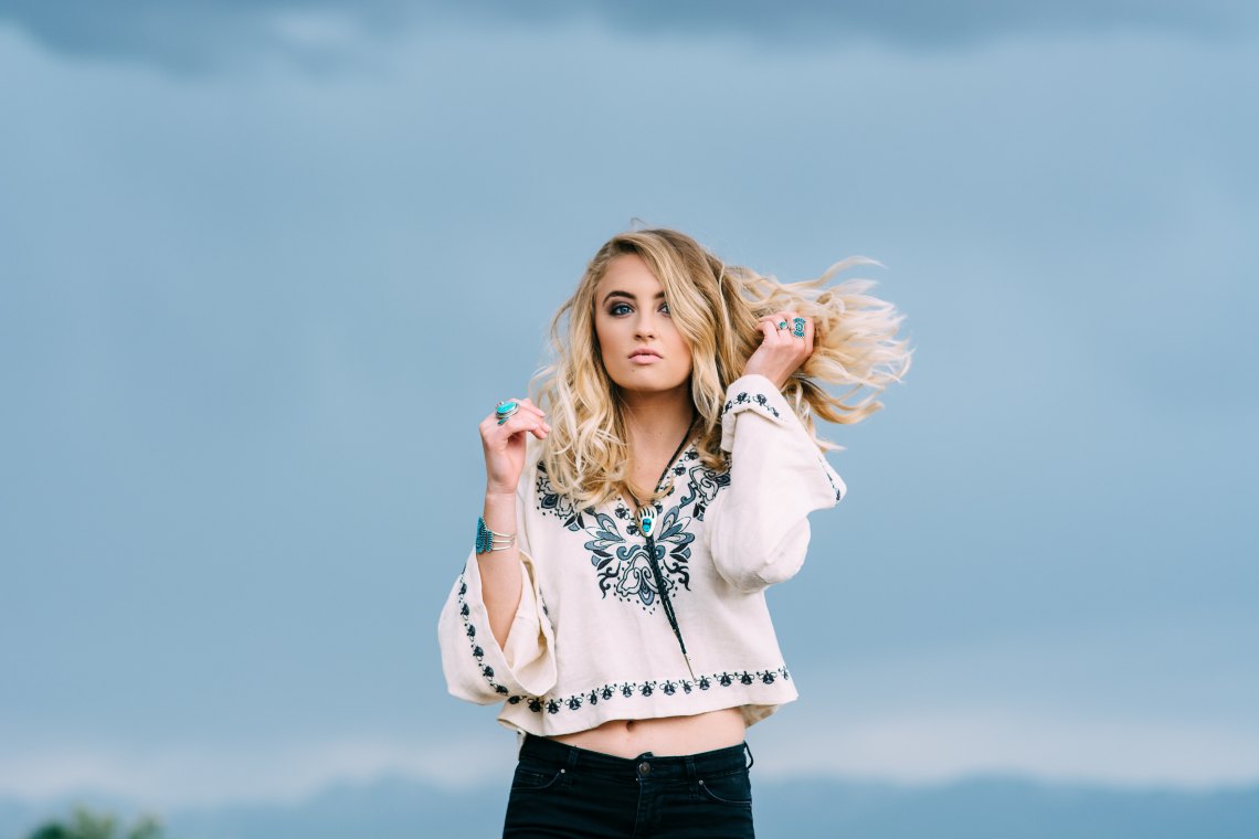 loves her life in a white top in the wind