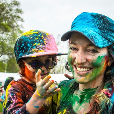 mother and child covered in paint