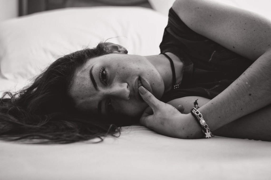 girl black and white in bed