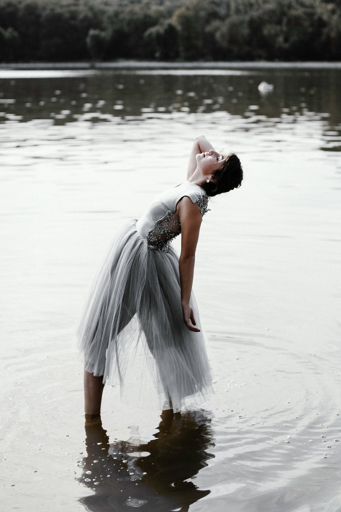 girl doing a backbend in water