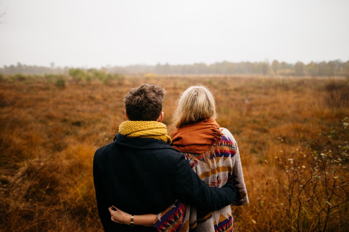 couple standing in field