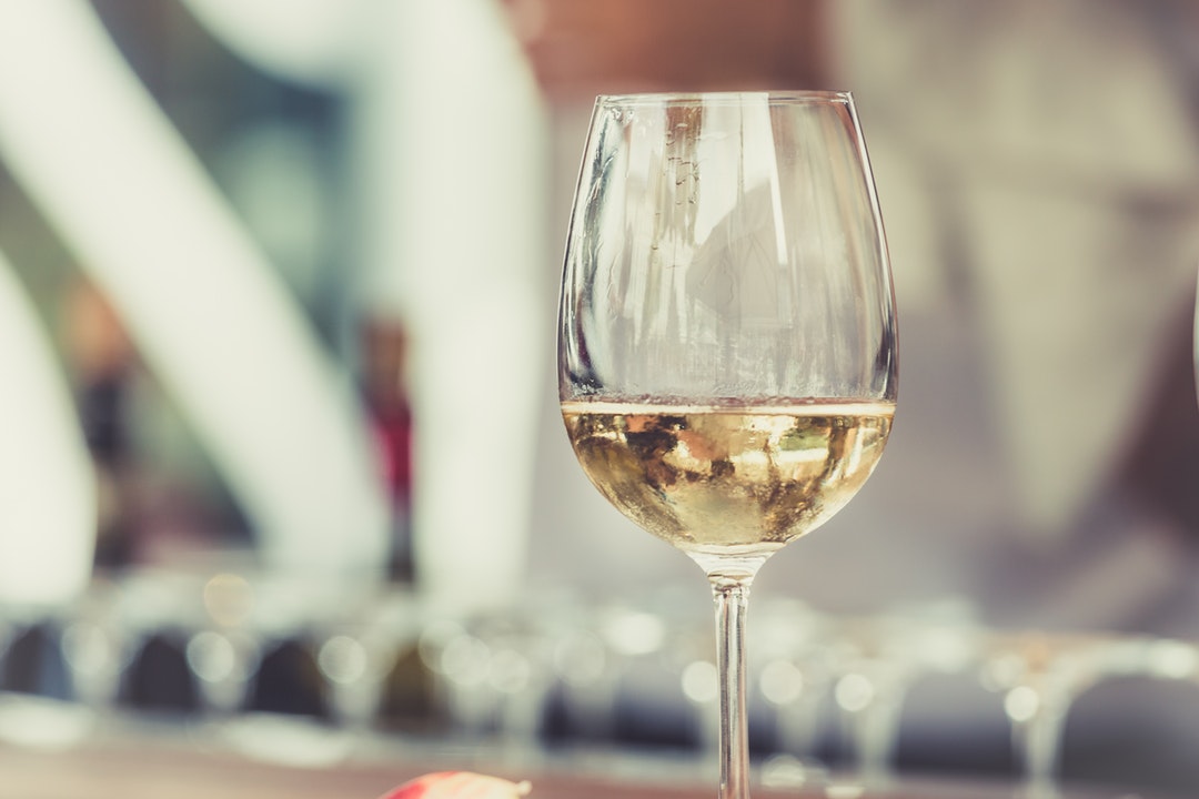 Macro view of a wine glass with wine in it in Torvehallerne