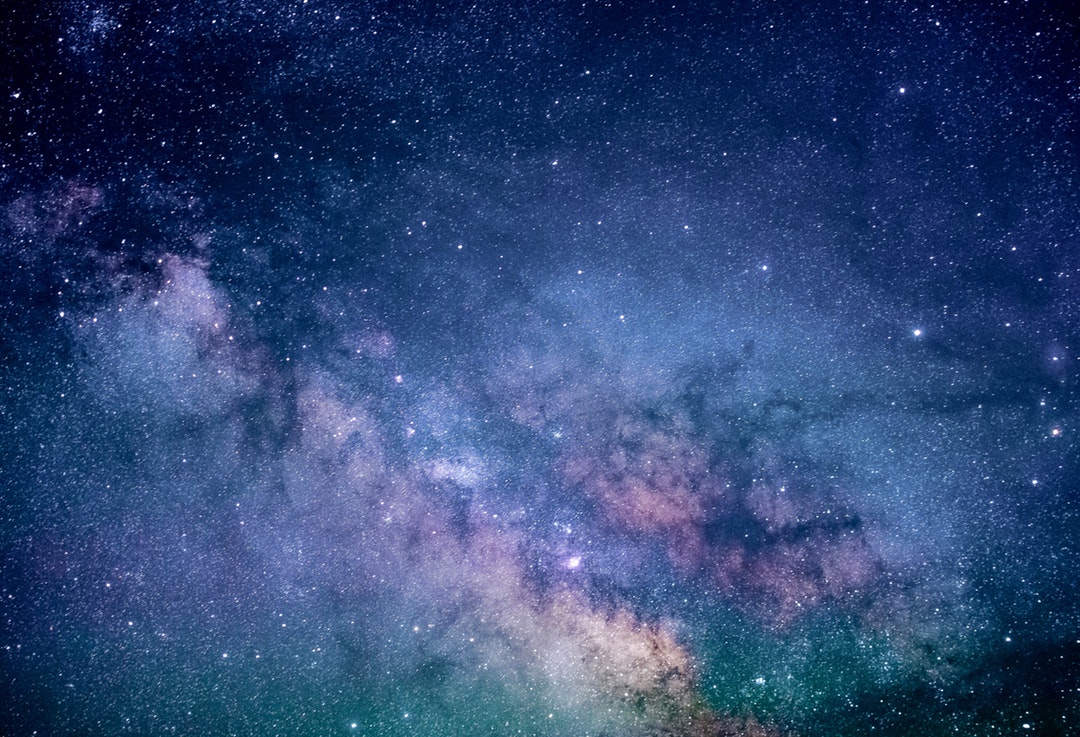 Colorful photo of a galaxy and stars at night