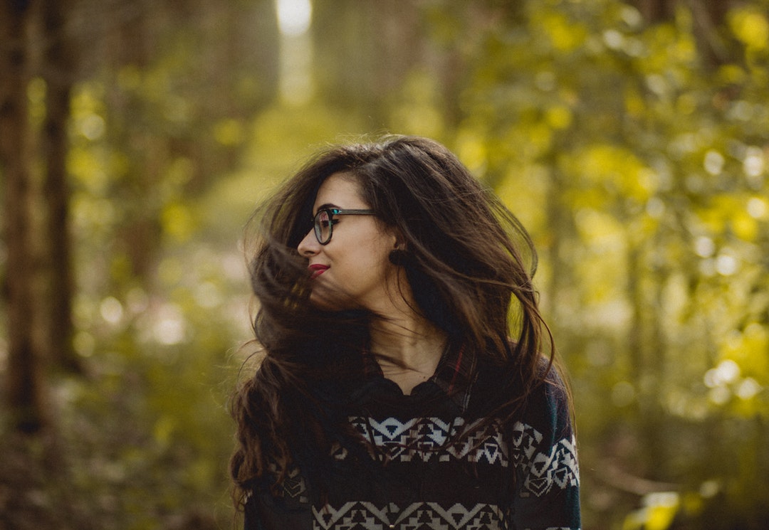 Happy woman smiling and shaking out her hair