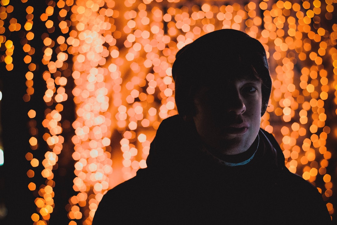 man in winter suit with light background