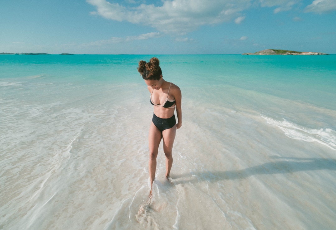 Woman in bikini on a tropical beach at Exuma