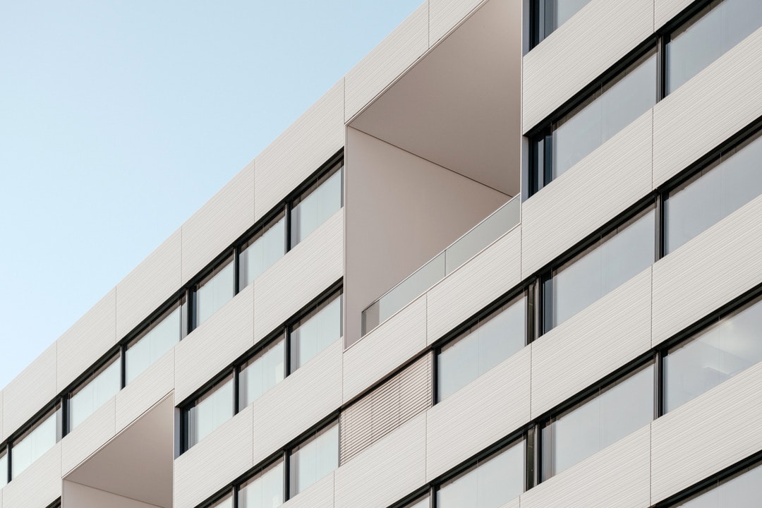 The facade of a residential building with large balconies