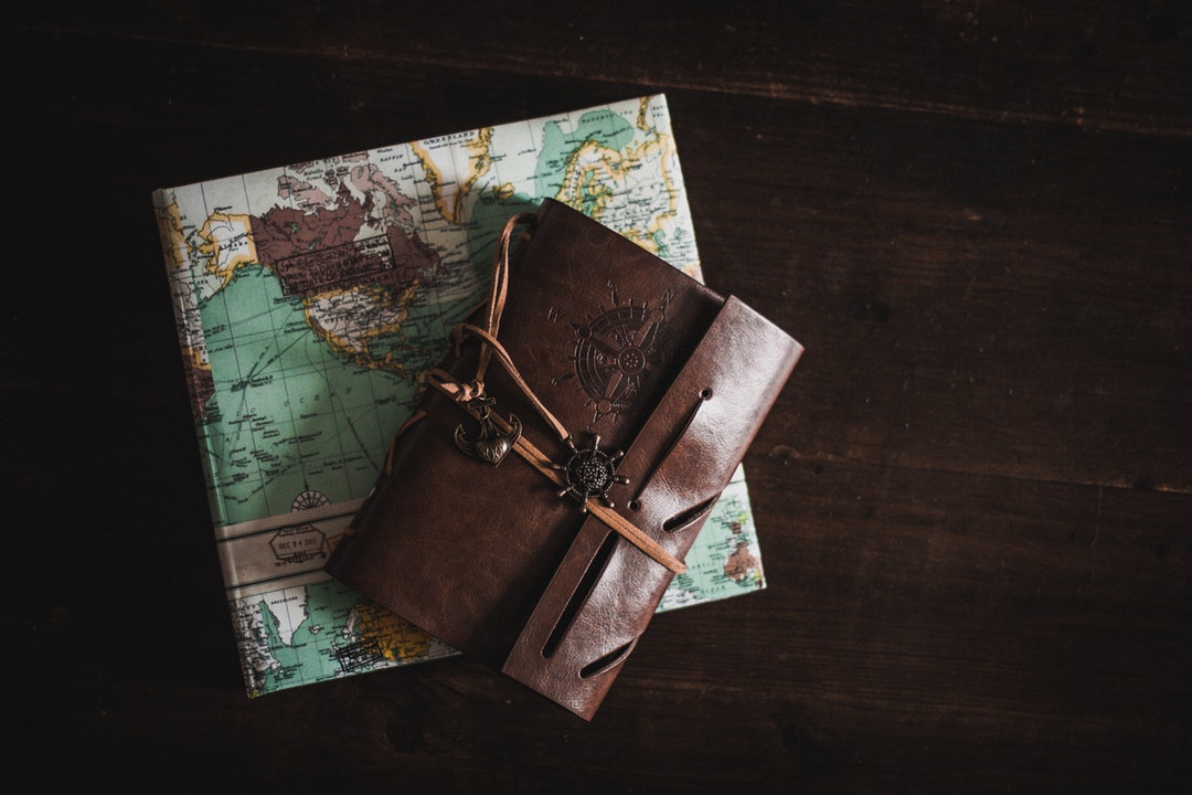 A leather journal and a travel diary as seen in Cologne.