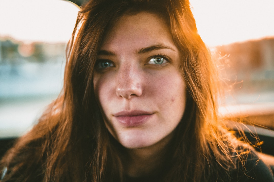 closeup photo of woman in black top