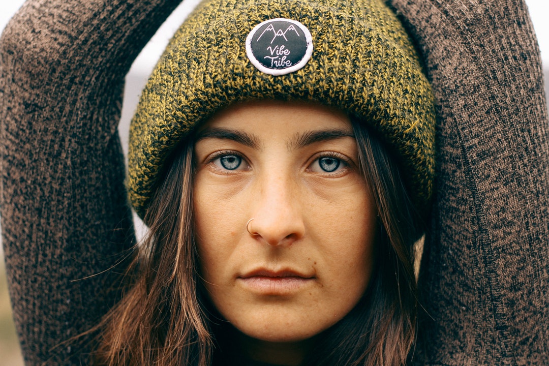 woman wearing green knit cap