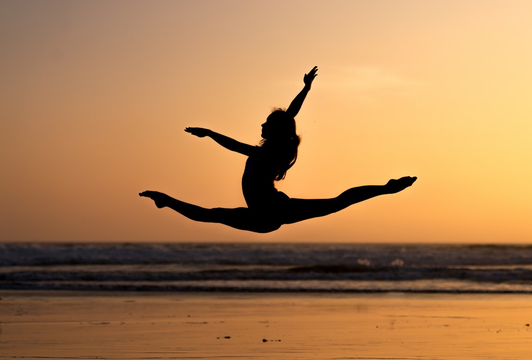 silhouette photography of woman doing ballet
