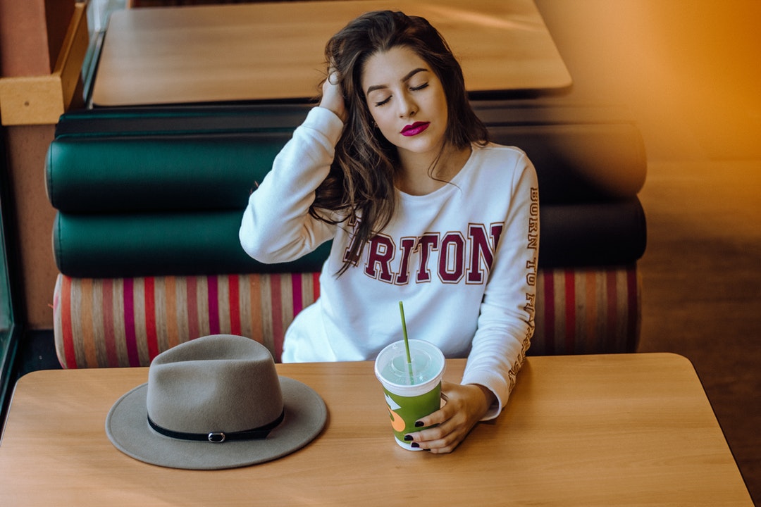 woman sitting on chair near table
