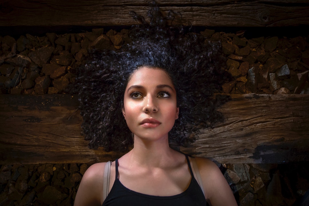 woman lying on brown plank