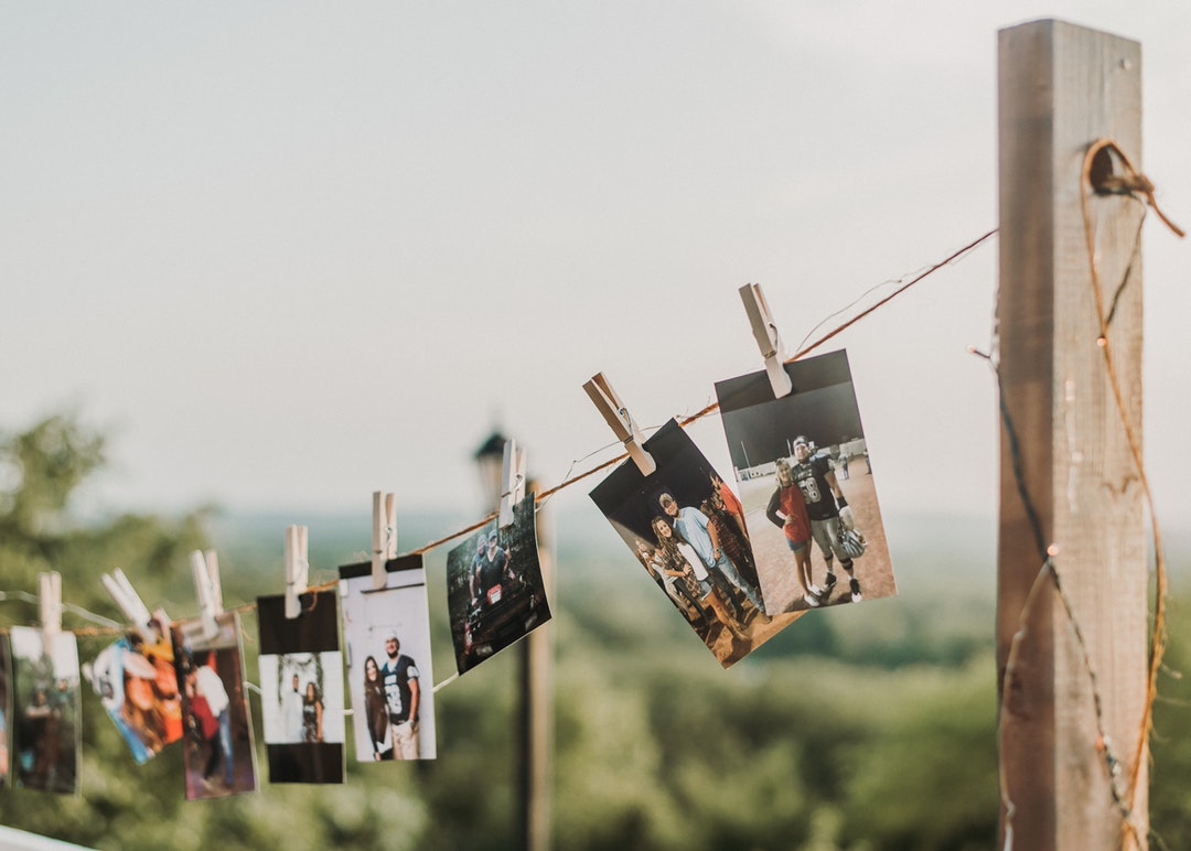 photos clipped on clothesline