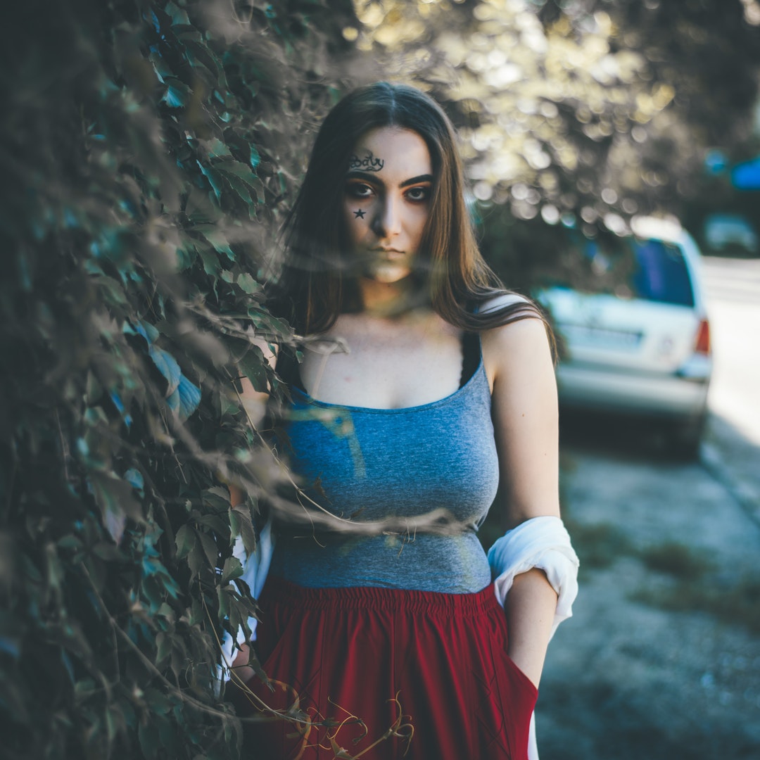 woman standing near car